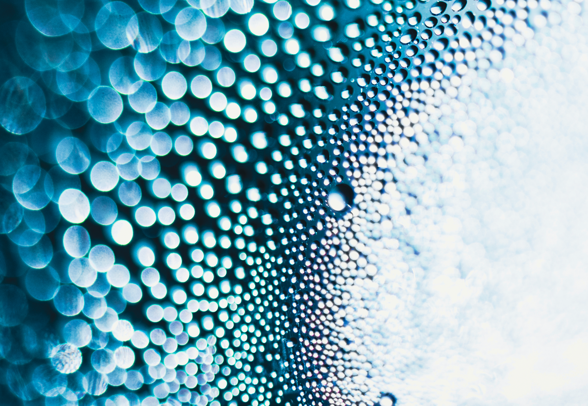 Person analyzing financial data on multiple monitors, representing banking operations